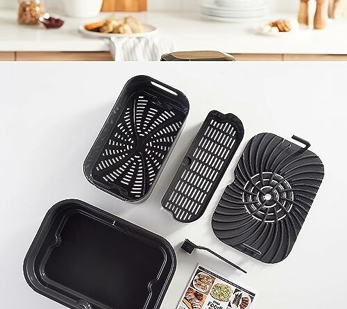 Air fryer with various accessories on a kitchen counter.