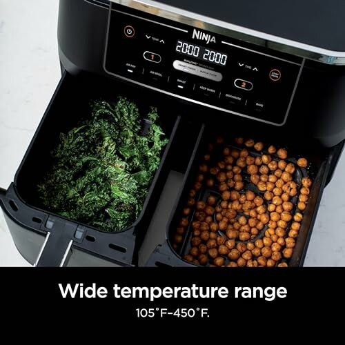 Ninja air fryer with kale and chickpeas in baskets.