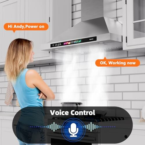 Woman using voice control for kitchen hood